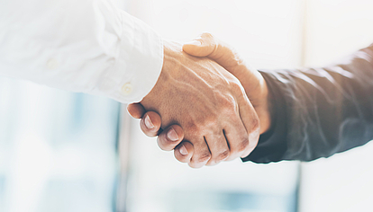 International coordination and notification partnership Two people shaking hands to symbolize international coordination and spectrum notification partnership with SPECTRAemc