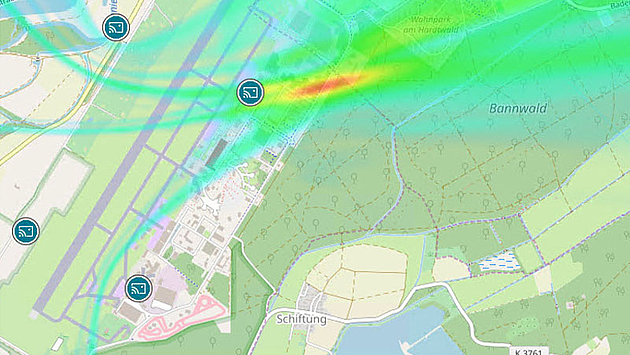 Street map showing 4 monitoring stations as icons and the result of the TDOA analysis as a heatmap. The heatmap shows the probability of the searched emitter being at a particular location from blue to red. Red represents the highest probability.