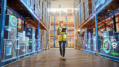 On-site Analyses of Wireless Devices and Interference Sources Warehouse environment showing a worker with a tablet conducting on-site analyses of wireless devices and identifying potential interference sources.