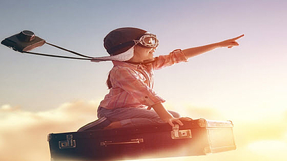 Future-Proof Radio Planning with CHIRplus_TC Software Child in aviator goggles pointing forward, symbolizing innovation and future-proof technology in CHIRplus_TC software.